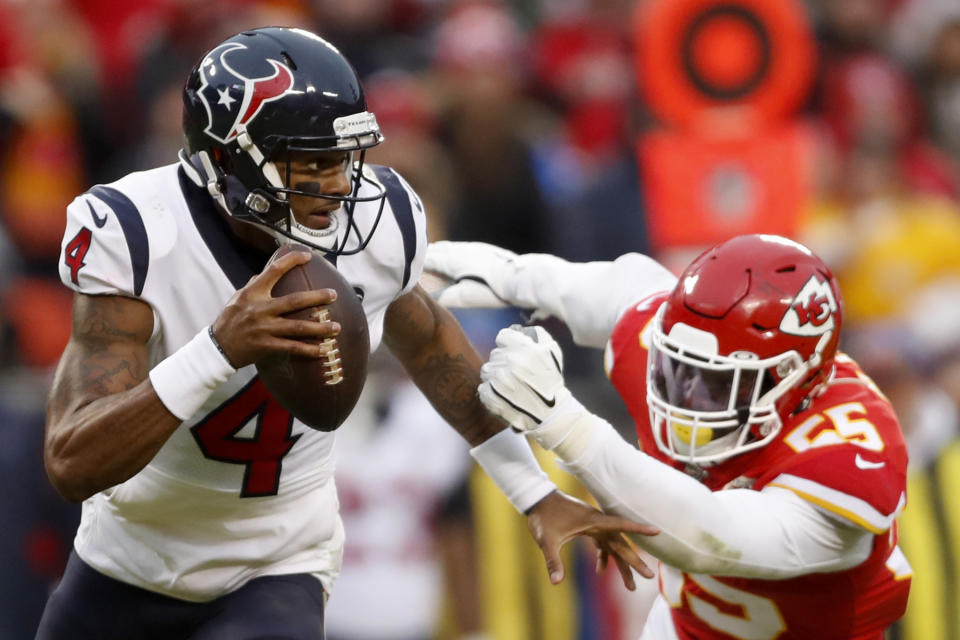 Houston Texans quarterback Deshaun Watson (4) scrambles under pressure from Kansas City Chiefs defensive end Frank Clark (55) during the second half of an NFL divisional playoff football game, in Kansas City, Mo., Sunday, Jan. 12, 2020. (AP Photo/Jeff Roberson)