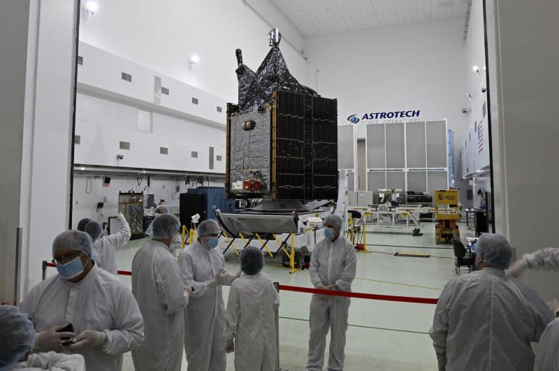 Members of the media are given an opportunity to view the NASA Psyche satellite at the Astrotech Space Operations Facility in Titusville, Fla. Photo by Joe Marino/UPI