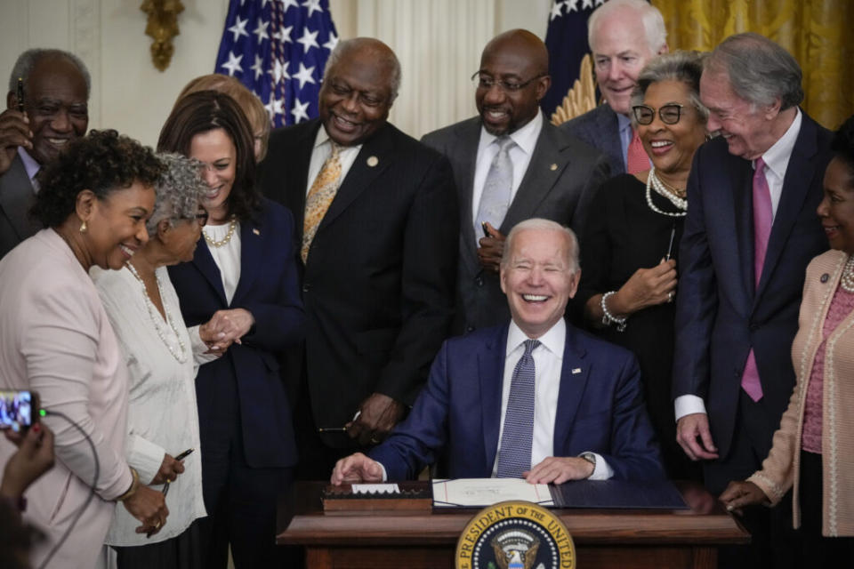 President Joe Biden signs the Juneteenth National Independence Day Act into law in the East Room of the White House on June 17, 2021