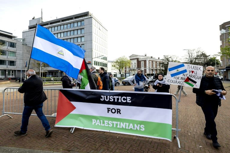 Protestors outside the International Court of Justice in The Hague on Monday (Robin van Lonkhuijsen)