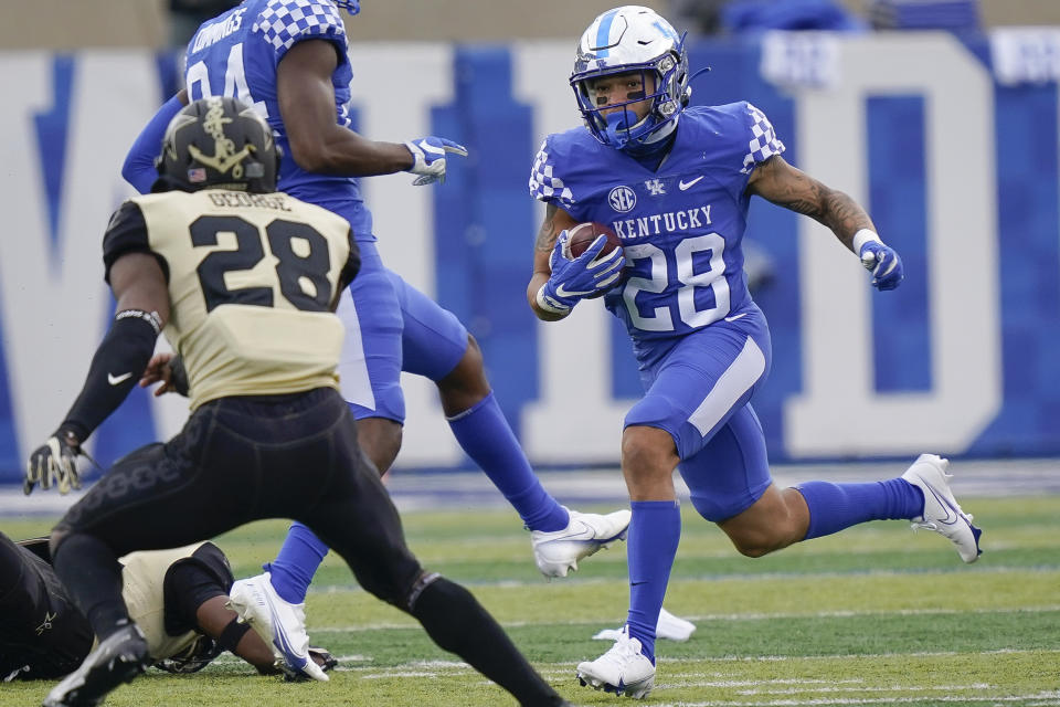 Kentucky wide receiver Rahsaan Lewis (28) runs with the ball during the first half of an NCAA college football game against Vanderbilt, Saturday, Nov. 14, 2020, in Lexington, Ky. (AP Photo/Bryan Woolston)