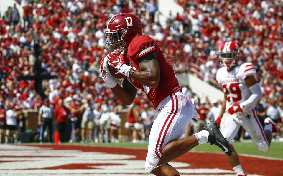 Alabama wide receiver Jaylen Waddle (17) catches a pass for a touchdown against Louisiana-Lafayette during the first half of an NCAA college football game, Saturday, Sept. 29, 2018, in Tuscaloosa, Ala. (AP Photo/Butch Dill)