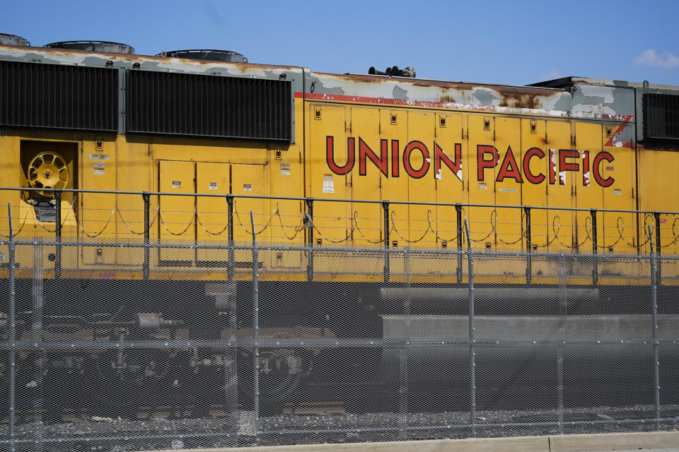 FILE - A Union Pacific train engine sits in a rail yard on Sept. 14, 2022, in Commerce, Calif. Federal regulators have ordered Union Pacific to make sure a California company gets the grain it needs to prevent millions of chickens from starving while it works to recover from the recent bitter cold and snow. This is the second time in the past year regulators issued an emergency order related to delivery problems at Foster Farms as the railroad struggled with a shortage of crews. (AP Photo/Ashley Landis, File)