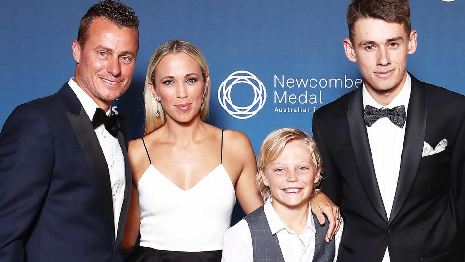 Lleyton Hewitt, pictured here with wife Bec, son Cruz and Alex de Minaur in 2018.