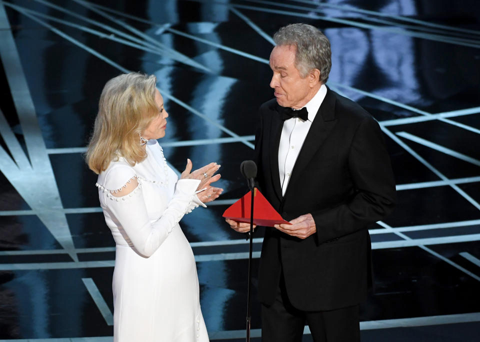 Actors Faye Dunaway (L) and Warren Beatty speak onstage during the 89th Annual Academy Awards at Hollywood & Highland Center on February 26, 2017 in Hollywood, California.  