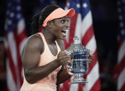 FILE - In this Sept. 9, 2017, file photo, Sloane Stephens, of the United States, holds up the championship trophy after defeating compatriot Madison Keys in the women's singles final of the U.S. Open tennis tournament in New York. Stephens is ranked No. 11 as she heads to the U.S. Open, where she won the title in 2017. (AP Photo/Julio Cortez, File)