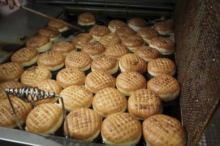 "Paczki" donuts are prepared at Delightful Pastries in Chicago, Illinois in this March 11, 2013 handout photo provided by Barbara Gasior Photography on February 3, 2016. REUTERS/Barbara Gasior Photography/Handout via Reuters