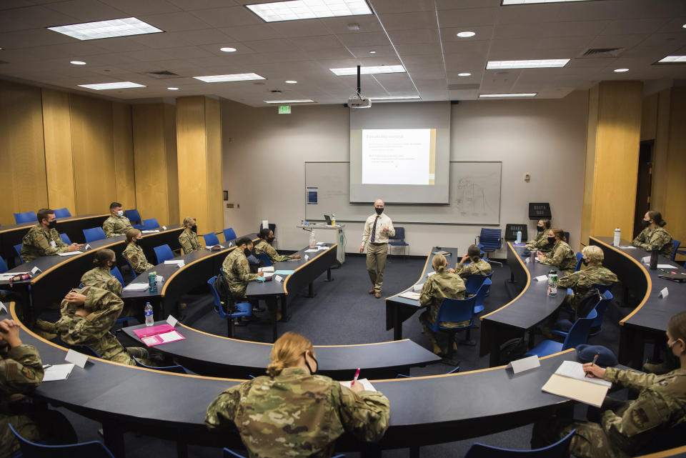 In this image provided by the U.S. Air force Academy, academy cadets start the school year with a mix of reduced class sizes and remote learning on Aug. 12, 2020, at the U.S. Air Force Academy in Colorado Springs, Colo. Under the siege of the coronavirus pandemic, classes have begun at the Naval Academy, the Air Force Academy and the U.S. Military Academy at West Point. But unlike at many colleges around the country, most students are on campus and many will attend classes in person. (Trevor Cokley/U.S. Air Force Academy via AP)