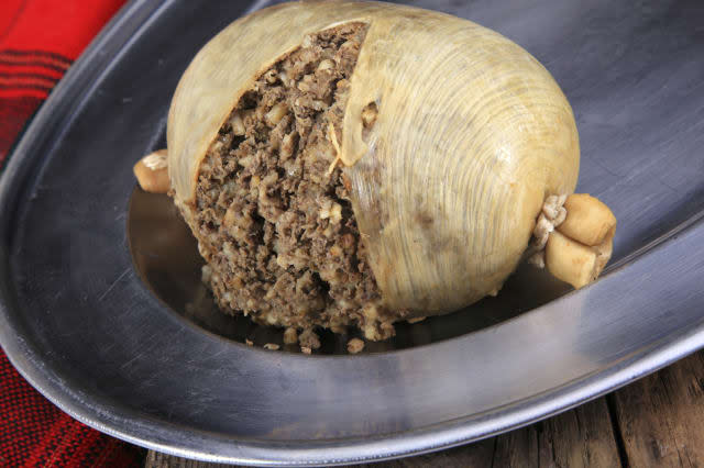 Scottish Haggis Cooked For A Burns Night Dinner Against A Royal Stuart Tartan