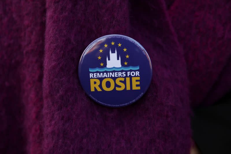 A badge supporting Rosie Duffield sits on the jacket of an activist in Canterbury