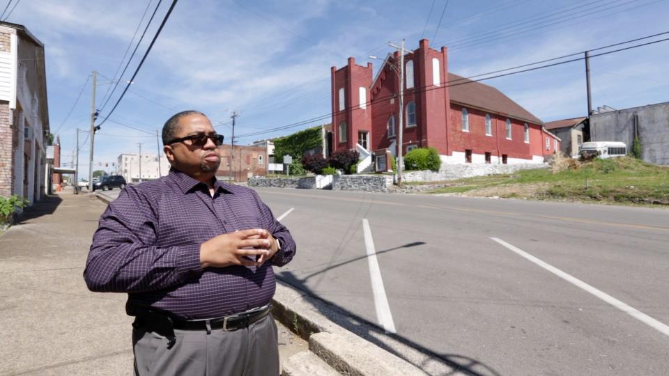 Trent Ogilvie, the executive director of the Columbia Housing and Redevelopment Corporation, stands along East 8th Street in Columbia, Tenn., on May 21, 2021. 