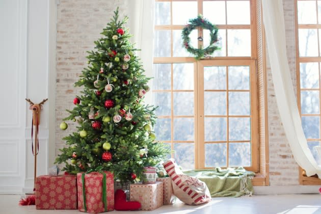 Christmas tree and gift boxes near the window - Credit: aprilante - stock.adobe.com