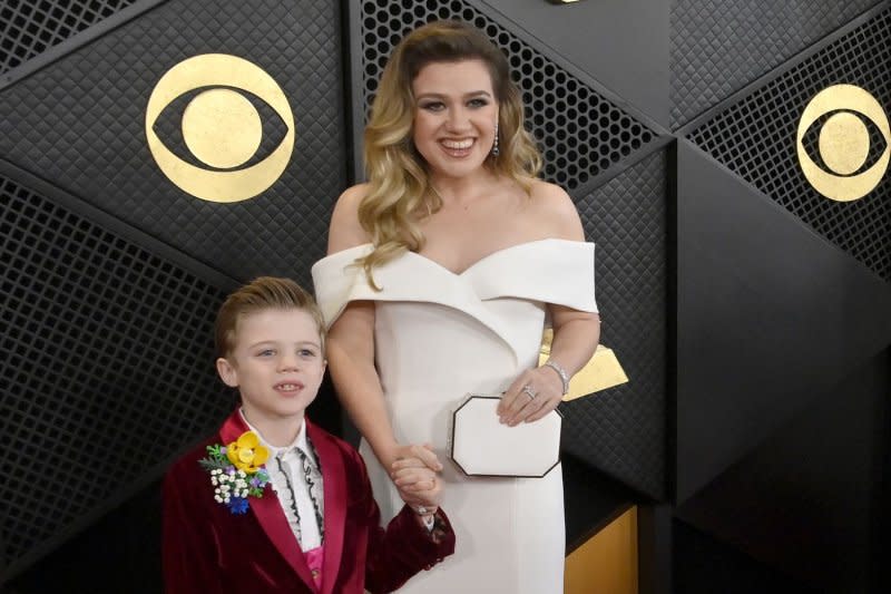 Kelly Clarkson (R), pictured with son Remy, will co-host the Olympics opening ceremony. File Photo by Jim Ruymen/UPI