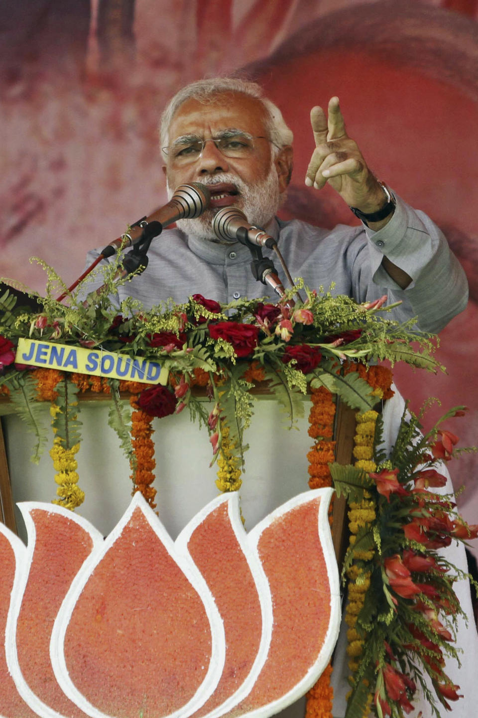 India's main opposition Bharatiya Janata Party's prime ministerial candidate Narendra Modi addresses his supporters during a campaign rally at Balasore, 200 kilometers (124 miles) from the eastern Indian city of Bhubaneswar, India, Friday, April 11, 2014. Indians voted in the crucial third phase of national elections Thursday, with millions going to the polls in the heartland states that are essential to the main opposition Hindu nationalist party's bid to end the 10-year rule of Congress party. (AP Photo/Biswaranjan Rout)