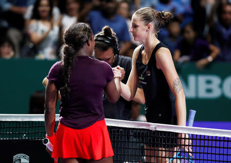 Tennis - WTA Tour Finals - Singapore Indoor Stadium, Kallang, Singapore - October 27, 2018 Sloane Stephens of the U.S. shakes hands with Czech Republic's Karolina Pliskova after their semi final match REUTERS/Edgar Su