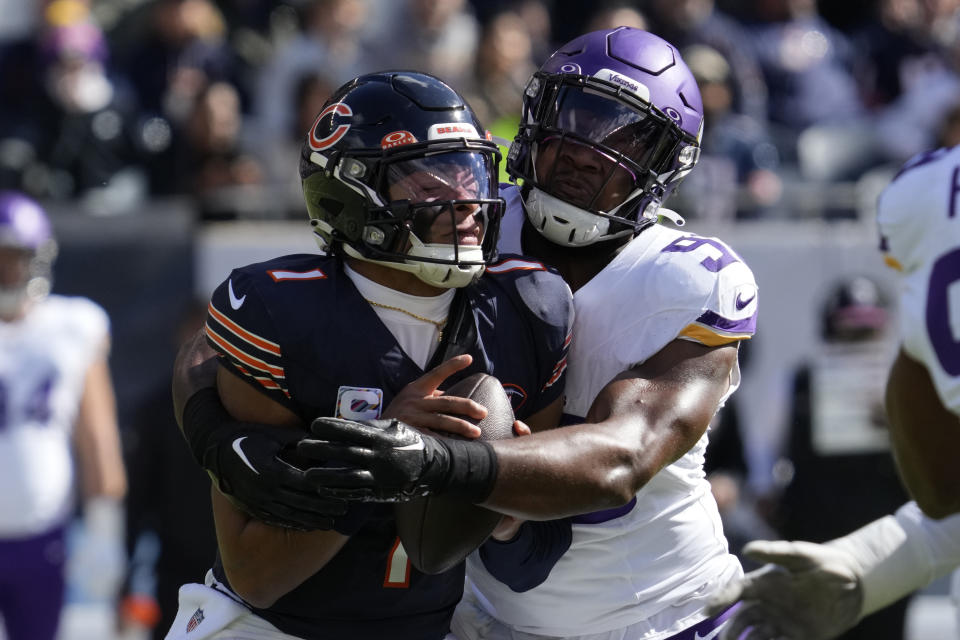Minnesota Vikings linebacker D.J. Wonnum (98) sacks Chicago Bears quarterback Justin Fields during the first half of an NFL football game, Sunday, Oct. 15, 2023, in Chicago. (AP Photo/Nam Y. Huh)