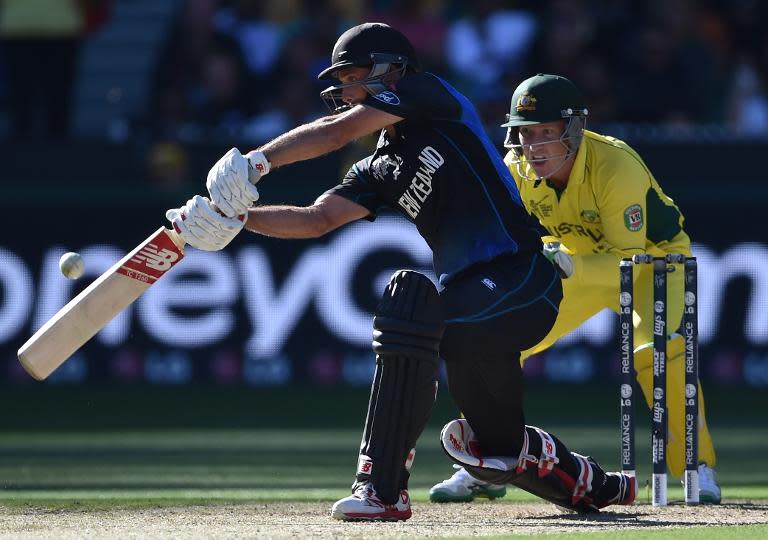 Grant Elliott plays a shot watched by Australian wicketkeeper Brad Haddin during the Cricket World Cup final in Melbourne on March 29, 2015