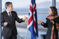 US Secretary of State Antony Blinken, left gestures as he meets Icelandic Prime Minister Katrin Jakobsdottir, at the Harpa Concert Hall in Reykjavik, Iceland, Tuesday, May 18, 2021. Blinken is touting the Biden administration's abrupt shift in its predecessor's climate policies as he visits Iceland for talks with senior officials from the world's Arctic nations. (Saul Loeb/Pool Photo via AP)