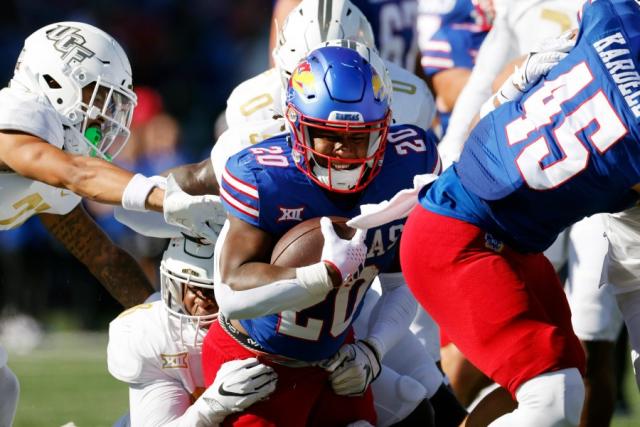 Daniel Hishaw Jr. rushes for a three-yard TD to extend Kansas' lead against  UCF