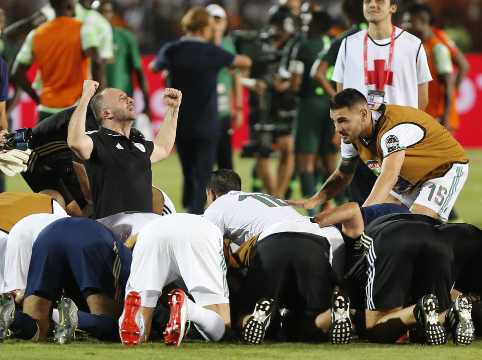 Algeria's head coach Djamel Belmadi celebrates after the African Cup of Nations semifinal soccer match between Algeria and Nigeria in Cairo International stadium in Cairo, Egypt, Sunday, July 14, 2019. (AP Photo/Amr Nabil)