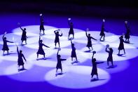 <p>Dancers perform during the figure skating gala event during the Pyeongchang 2018 Winter Olympic Games at the Gangneung Oval in Gangneung on February 25, 2018. / AFP PHOTO / ARIS MESSINIS (Photo credit should read ARIS MESSINIS/AFP/Getty Images) </p>