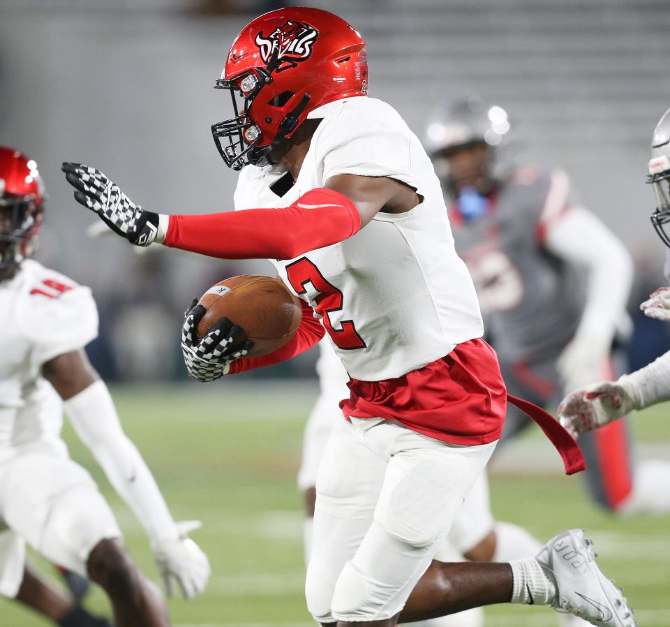 Central wide receiver Karmello English (2) returns a kick during the 7A state championship game in Birmingham Wednesday, Dec. 1, 2021. [Staff Photo/Gary Cosby Jr]