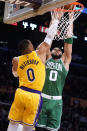 Boston Celtics forward Jayson Tatum, right, shoots over Los Angeles Lakers guard Russell Westbrook during the first half of an NBA basketball game Tuesday, Dec. 7, 2021, in Los Angeles. (AP Photo/Marcio Jose Sanchez)