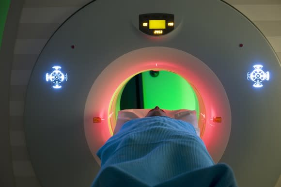 Patient going into an MRI with various colors and displays.