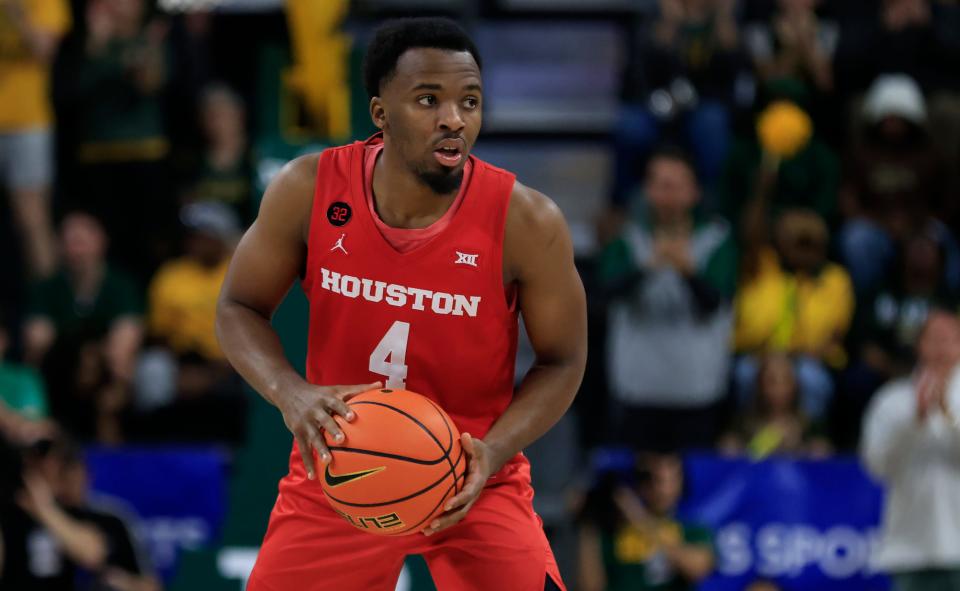 WACO, TX - FEBRUARY 24: L.J. Cryer #4 of the Houston Cougars handles the ball against the Baylor Bears in the second half at Foster Pavilion on February 24, 2024 in Waco, Texas. (Photo by Ron Jenkins/Getty Images)
