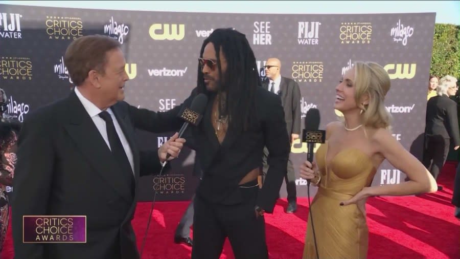 Jessica Holmes and Sam Rubin speaking to Lenny Kravitz on the red carpet. (KTLA)