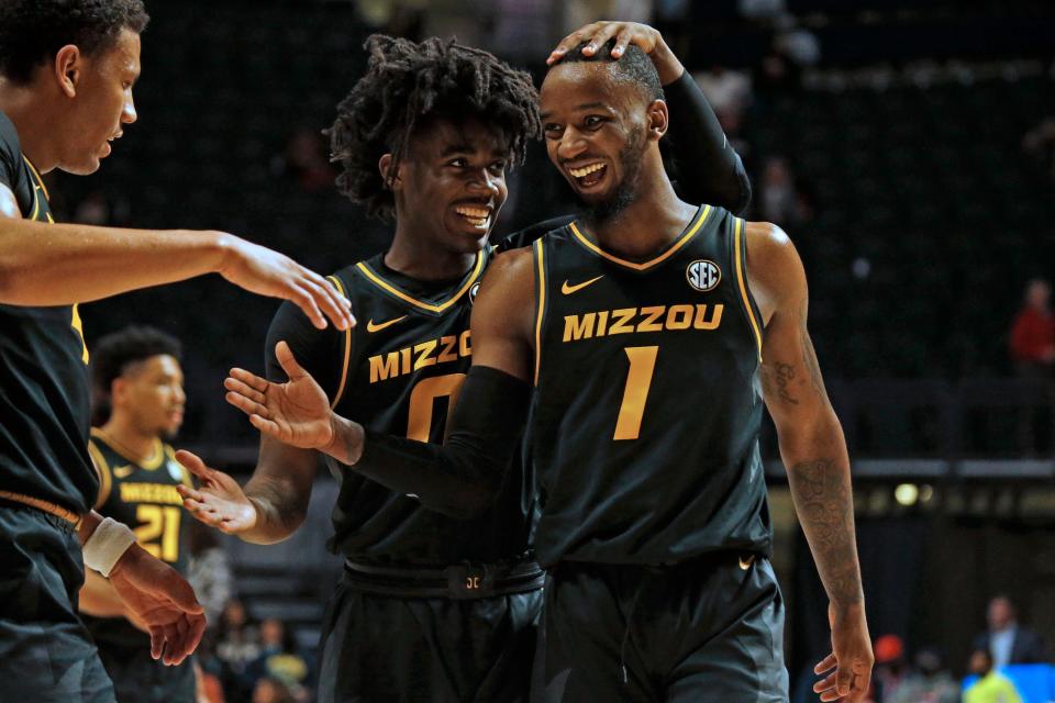 Missouri guards Anton Brookshire (0) and Amari Davis (1) react after defeating Mississippi at The Sandy and John Black Pavilion at Ole Miss on Jan. 18 in Oxford, Miss.