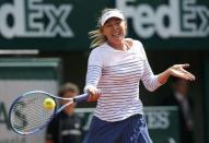 Maria Sharapova of Russia plays a shot to compatriot Vitalia Diatchenko during their women's singles match at the French Open tennis tournament at the Roland Garros stadium in Paris, France, May 27, 2015. REUTERS/Gonzalo Fuentes