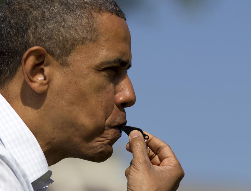 President Barack Obama blows the whistle to start the annual Easter Egg Roll on the South Lawn of the White House in Washington, Monday, April 9, 2012. (AP Photo/Carolyn Kaster)