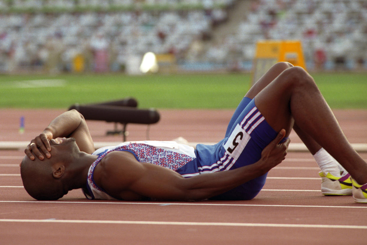 DEREK REDMOND (GBR) LIES ON THE FLOOR IN AGONY AFTER AN INJURY IN THE 400M  (Photo by Ross Kinnaird/EMPICS via Getty Images)