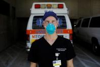 Dennis D'Urso, a resident ER doctor at Jackson Memorial Hospital, poses for a photo during his shift amid an outbreak of the coronavirus disease (COVID-19), in Miami