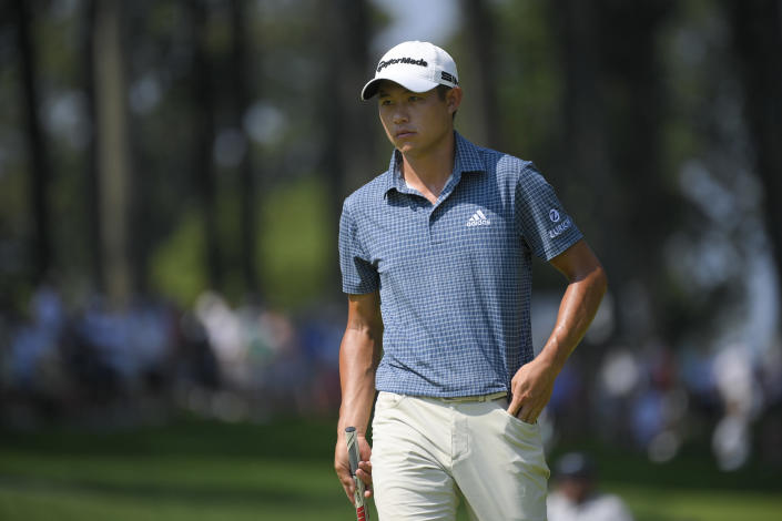 Collin Morikawa approaches his ball on the first green during the second round of the BMW Championship golf tournament, Friday, Aug. 27, 2021, at Caves Valley Golf Club in Owings Mills, Md. (AP Photo/Nick Wass)