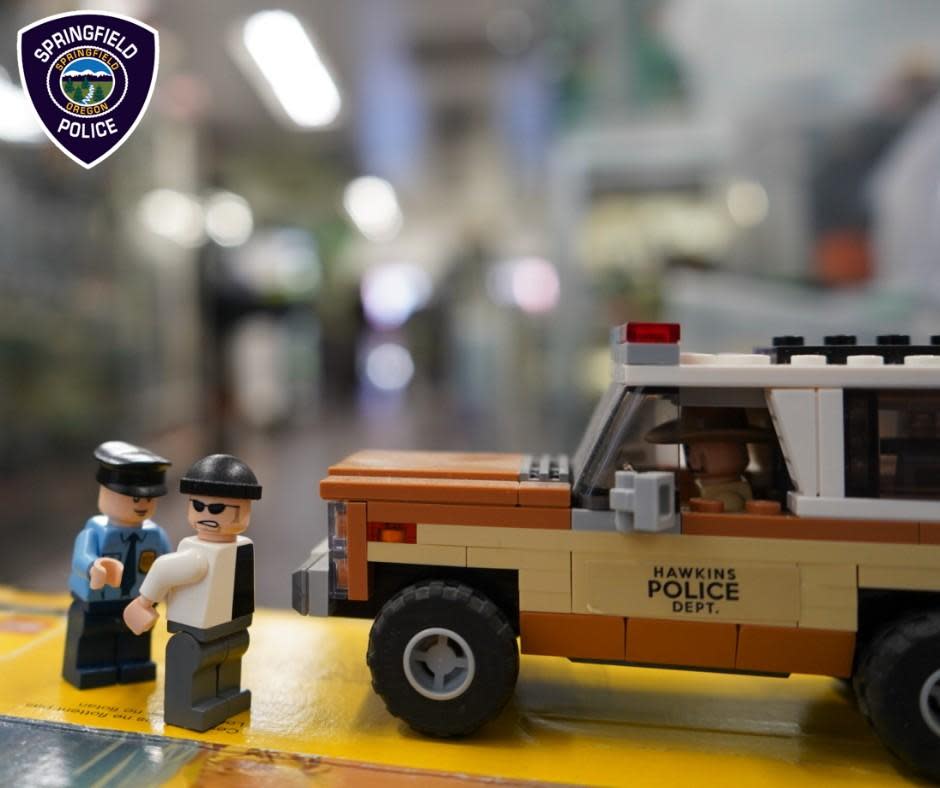 An image shared by the Springfield Police Department shows a Lego police officer arresting a Lego suspect.  / Credit: Springfield Police Department