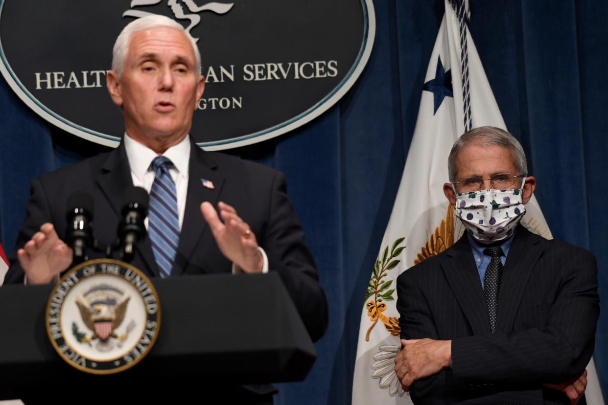 Mike Pence speaks at a briefing by the coronavirus task force as Anthony Fauci looks on: AP