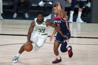 Boston Celtics' Semi Ojeleye (37) drives past Washington Wizards' Jerome Robinson (12) during the second half of an NBA basketball game Thursday, Aug. 13, 2020 in Lake Buena Vista, Fla. (AP Photo/Ashley Landis, Pool)