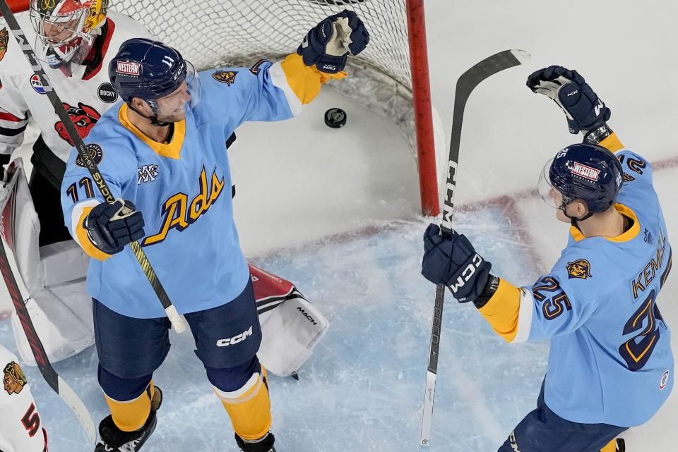 Milwaukee Admirals' Cody Hodgson is congratulated after scoring a goal against the Rockford Icehogs during an American Hockey League game Friday, March 1, 2024, in Milwaukee. Hodgson is a former NHL player who retired from hockey eight years ago due to a muscle disorder but is now making a comeback. (AP Photo/Morry Gash)