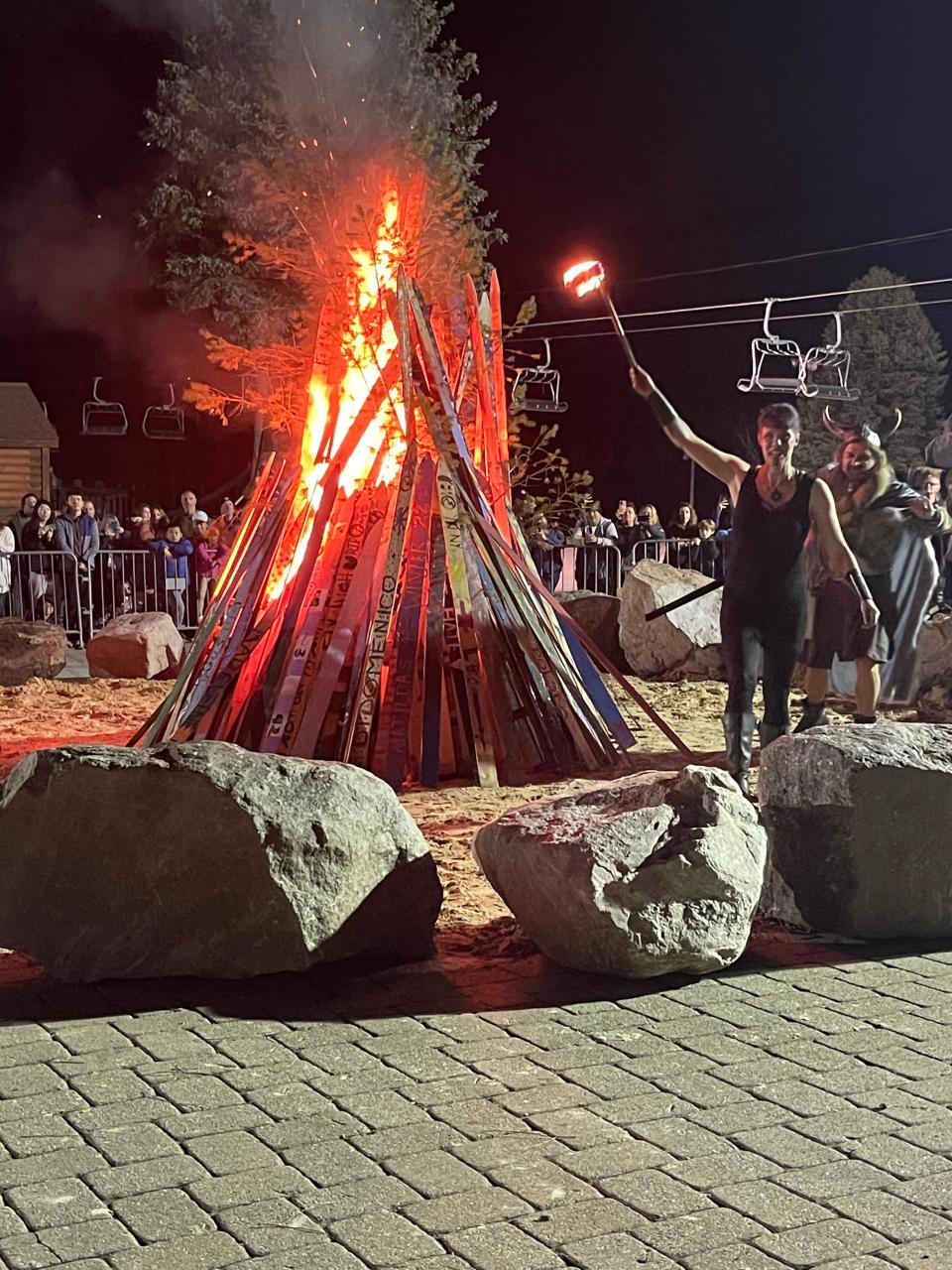 A fire dancer and viking lit the bonfire for Ullr, a Norse god that winter sports fans call to for a snowy winter on Saturday, Nov. 12, 2022.