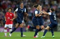 LONDON, ENGLAND - AUGUST 09: Carli Lloyd #10 of United States celebrates with Kelley O'Hara #5 and Shannon Boxx #7 after scoring in the second half against Japan during the Women's Football gold medal match on Day 13 of the London 2012 Olympic Games at Wembley Stadium on August 9, 2012 in London, England. (Photo by Julian Finney/Getty Images)
