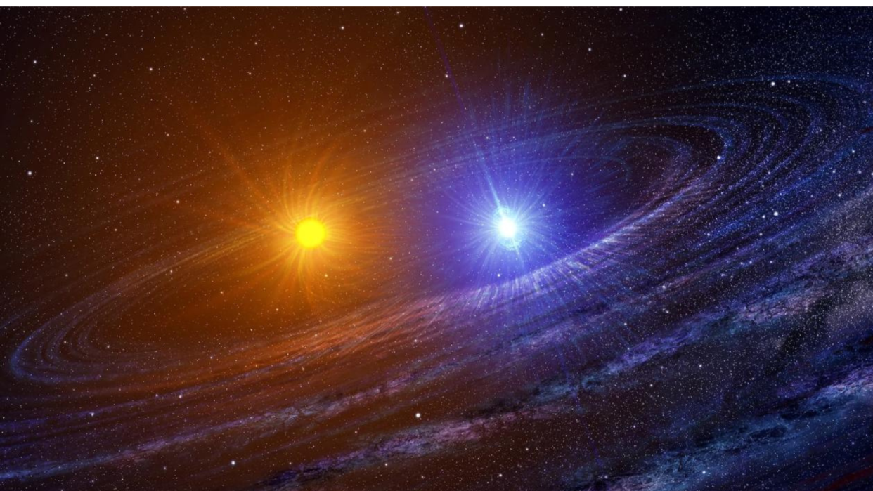  Illustration of a yellow star and a blue star circling close to each other. 