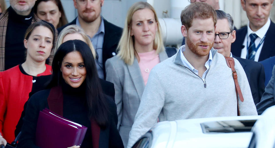 Meghan carried folders as she and Harry landed in Australia (Getty)