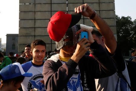 A man plays Pokemon Go during a gathering to celebrate "Pokemon Day" in Mexico City, Mexico August 21, 2016. REUTERS/Carlos Jasso