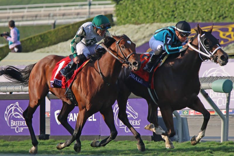 Nobals, Gerardo Corrales up, edges Big Invasion, ridden by Joel Rosario, to win the Breeders Cup Turf Sprint during the 40th running of the Breeders' Cup Championships at Santa Anita Park in Arcadia, Calif., on Saturday. Photo by Mark Abraham/UPI