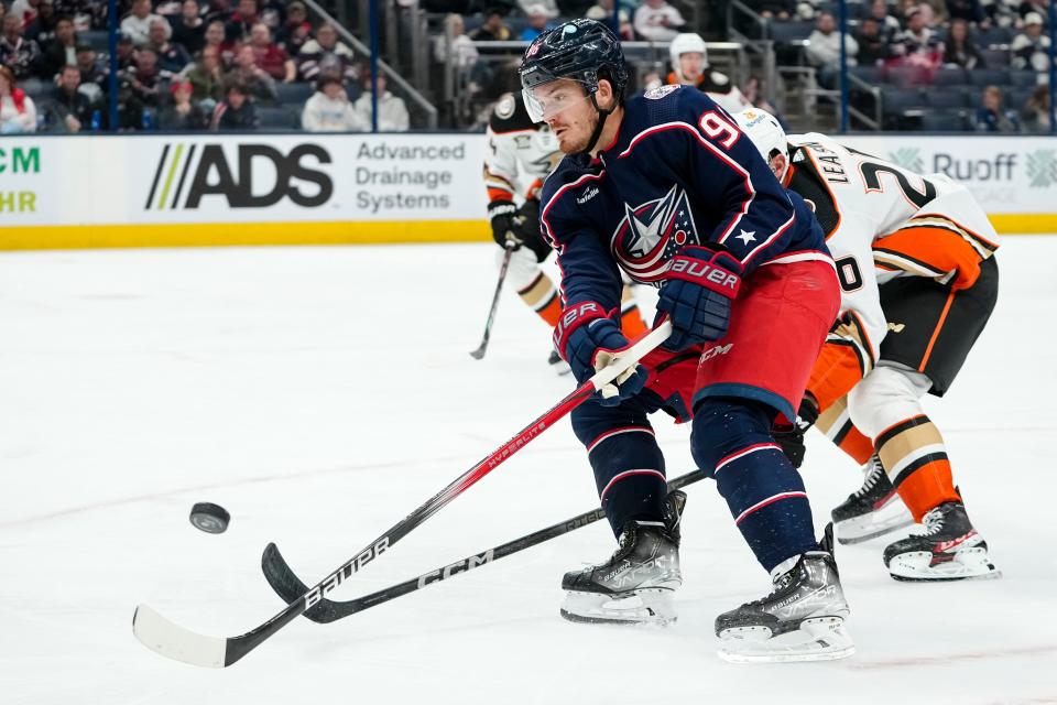Oct 24, 2023; Columbus, Ohio, USA; Columbus Blue Jackets center Jack Roslovic (96) moves the puck up ice ahead of Anaheim Ducks right wing Brett Leason (20) during the third period of the NHL game at Nationwide Arena. The Blue Jackets lost 3-2 (OT).