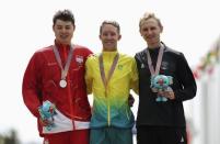 Cycling - Gold Coast 2018 Commonwealth Games - Men's Individual Time Trial - Currumbin Beachfront - Gold Coast, Australia - April 10, 2018. Gold medallist Cameron Meyer of Australia, silver medallist Harry Tanfield of England and bronze medallist Hamish Bond of New Zealand pose with their medals. REUTERS/Athit Perawongmetha