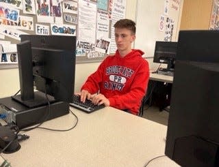 Cole Bridges working on an assignment in one of his classes at Bridgewater-Raynham High School