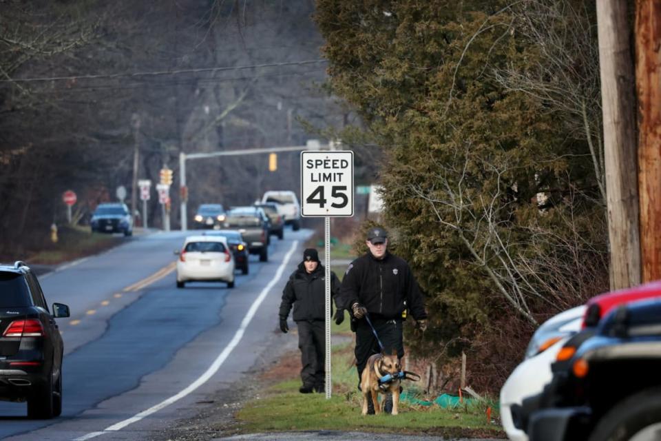 <div class="inline-image__caption"><p>Cohasset, MA - January 7: Members of a Massachusetts State Police K-9 unit search for missing person Ana Walshe on Chief Justice Cushing Highway.</p></div> <div class="inline-image__credit">Craig F. Walker/The Boston Globe via Getty</div>